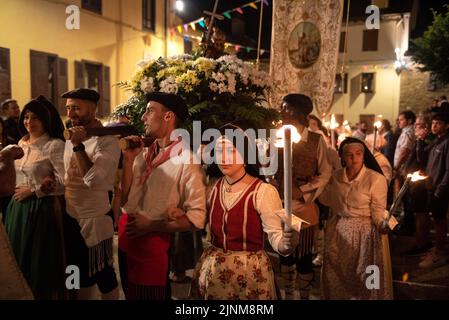 Procession of Saint John towards the Haro square in Les on the Sant Joan night festivity (Les, Aran Valley, Lleida, Catalonia, Spain, Pyrenees) Stock Photo