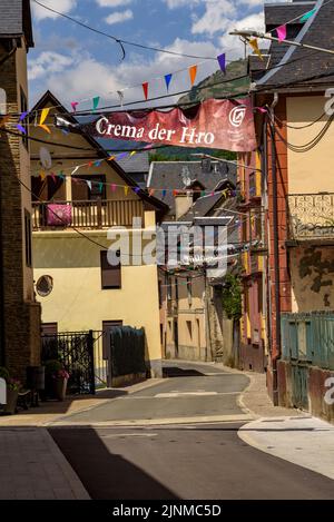 Village of Les decorated for the festival of Sant Joan due to the summer solstice (Aran Valley, Lleida, Catalonia, Spain, Pyrenees) ESP: Pueblo de Les Stock Photo