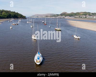 Conwy, Clwyd, Wales, August 07 2022: Boats moored in Conwy estuary looking towards the sea. Stock Photo