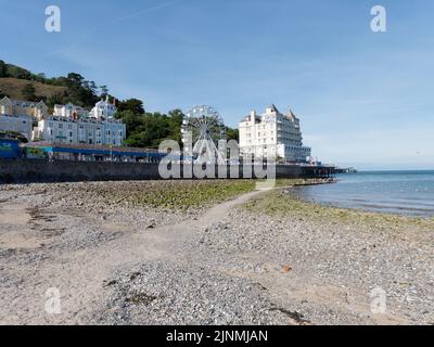 Llandudno, Clwyd, Wales, August 07 2022: Grand Hotel and big wheel as seen from the beach. Stock Photo