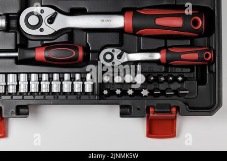 A set of keys and sockets of various sizes with various hex ends in a black box. Close-up Stock Photo