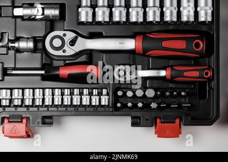 Spanners of various sizes with various hex sockets in a black box Stock Photo