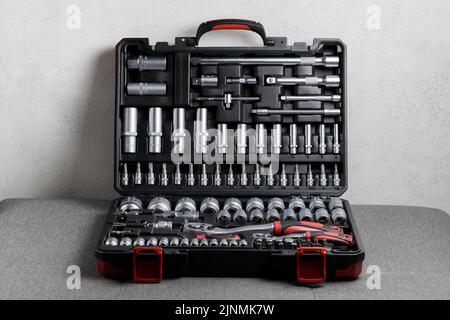 Tool box, details of a set of tools on a gray background. Tools. A set of tools. Car tool kit. Repair tools Stock Photo