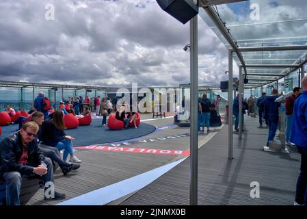 Paris, France - May 27, 2022: Top of Montparnasse Tower showing numerous tourists and bar on the observation deck overlooking Paris Stock Photo