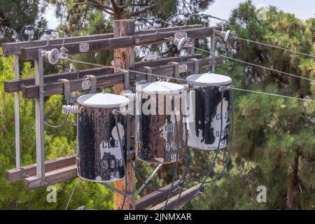 August 4, 2022 - Los Angeles, CA, USA: Close up of three transformers on an electrical pole in Los Angeles, CA. Stock Photo
