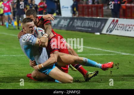 Ash Handley #5 of Leeds Rhinos is tackled by Ben Crooks #2 and Matt Parcell #9 of Hull KR in, on 8/12/2022. (Photo by David Greaves Photos/ Via/News Images/Sipa USA) Credit: Sipa USA/Alamy Live News Stock Photo