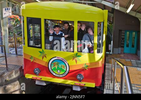 Happy passengers arrive at cable car station at Mt. Takao, Japan Stock Photo