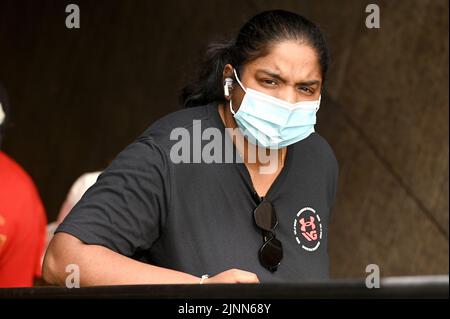 New York, USA. 12th Aug, 2022. A woman wear a protective face masks and rides an escalator out of the Bowling Green subway station in lower Manhattan, New York, NY, August 12, 2022. The Centers for Disease Control (CDC) announced revised guidelines that include not screening people without symptoms, updating school protocols, and not needing to wear a mask after five days of quarantine and testing negative on the 6th and 8th day; the CDC emphasized personal responsibility and choice in the face of COVID-19 that continues to spread across the United States in its variant forms. (Photo by Anthon Stock Photo