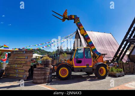 Telescopic forklift, construction machine painted in rainbow colours, SALT entrance, art project at Langkaia jetty, Oslo city centre, Norway Stock Photo