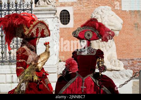 Costumed women, traditional Venetian masks, carnival in Venice, Veneto, Italy Stock Photo