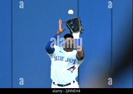 Toronto Blue Jays left fielder Lourdes Gurriel Jr., left, Teoscar Hernandez  and Jackie Bradley Jr., right, celebrate after the ninth inning of the  team's baseball game against the New York Yankees on