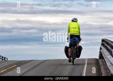 Cyclist on Atlantic Road, Bridge, Norwegian Landscape Route Atlanterhavsveien between Molde and Kristiansund, More og Romsdal, Atlantic Coast, Norway Stock Photo