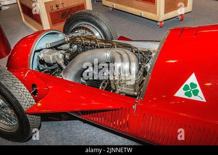 View into engine compartment of historic Italian racing car Alfa Romeo GP Tipo 158 Alfetta first Formal 1 winner 1950 50s, right logo Quadrifoglio Stock Photo