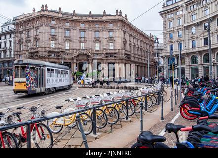 Tram and rental bikes in Piazza Cordusio in the centre, Milan, Lombardy, Northern Italy, Italy Stock Photo