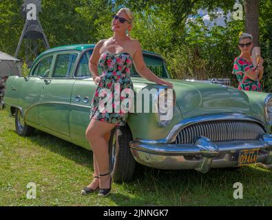 American vintage Buick with two woman Stock Photo