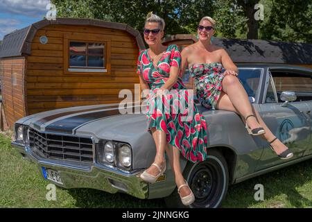 American vintage Buick with two woman Stock Photo