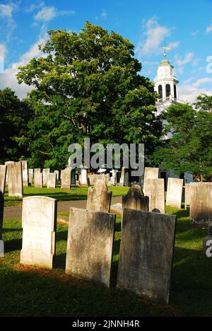 A historic graveyard stands on the grounds of the Church on the Hill, a small Christian church in Lenox Massachusetts Stock Photo