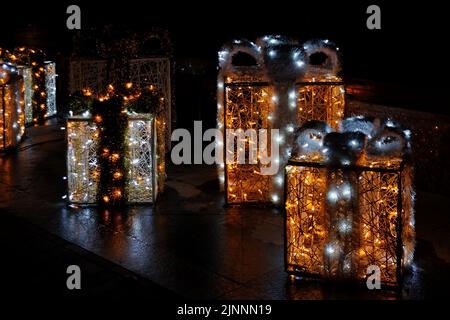 Gift boxes made of street lights at night in Kyiv Ukraine Stock Photo