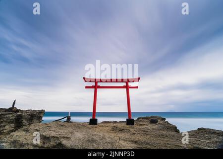 Long exposure shot of Shirahama shrine torii gate over the sea and sky, Shizuoka Prefecture, Japan Stock Photo