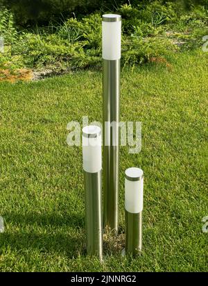 Elactric lamp on green grass background. Selective focus. Stock Photo