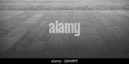 Abstract background of an old cobblestone sidewalk close-up. Stock Photo