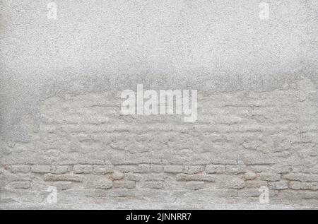 Old plastered brick wall of light tones Stock Photo