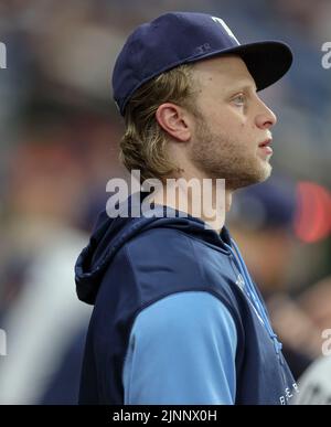 St. Petersburg, FL. USA;  Tampa Bay Rays rookie pitcher Shane Baz (11) who is on he 60-IL watches the game from the dugout during a major league baseb Stock Photo