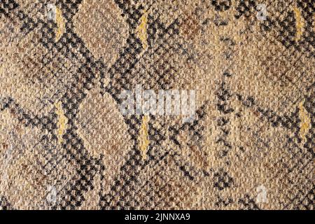 Smooth brown and black cotton fabric with stylish snake print Stock Photo