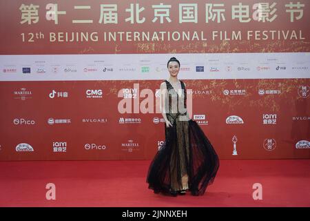 Beijing, China. 12th Aug, 2022. Actress Qi Xi walks on the red carpet of the 12th Beijing International Film Festival in Beijing, capital of China, Aug. 12, 2022. Credit: Chen Zhonghao/Xinhua/Alamy Live News Stock Photo