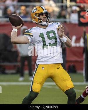 Green Bay Packers quarterback Danny Etling (19) runs for a touchdown during  an NFL Preseason game against the New Orleans Saints Friday, Aug. 19, 2022,  in Green Bay, Wis. (AP Photo/Jeffrey Phelps