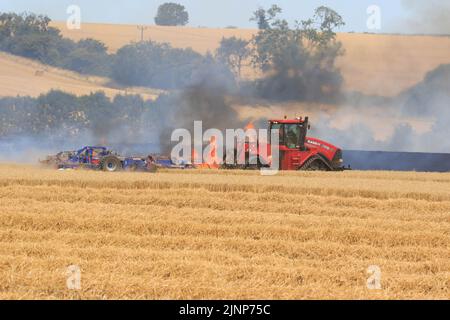 7-8-2022 Firefighters and farmers tackle a massive field fire in a crop of standing Wheat close to the village of Ridlington, Rutland  ©Tim Scrivener Photographer 07850 303986      ....Covering Agriculture In The UK.... Stock Photo