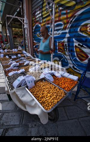 Street seller of flavored dried fruits in Athens Stock Photo