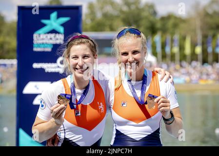 Munich, Germany. 13th Aug, 2022. MUNCHEN - Veronique Meester and Ymkje Clevering with their bronze medal in the two without rowing on the third day of the Multi-European Championship. The German city of Munich will host a combined European Championship of various sports in 2022. ANP ROBIN VAN LONKHUIJSEN Credit: ANP/Alamy Live News Stock Photo