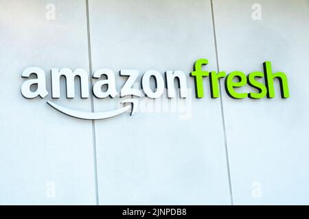 Canary Wharf, London, UK.  Low angle view of Amazon Fresh brand logo on building exterior located at Canary Wharf. Stock Photo