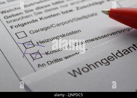 Dresden, Germany. 11th Aug, 2022. ILLUSTRATION - A pencil lies on a housing subsidy application on a table. (posed scene) Credit: Robert Michael/dpa/Alamy Live News Stock Photo