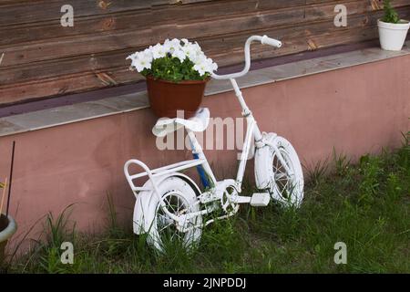 Children bicycle. Painted white. Interior and exterior details. Close-up. Stock Photo