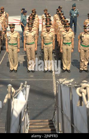 Indonesian navy cadets and officers lining up for a briefing, photographed from KRI Dewaruci (Dewa Ruci), an Indonesian tall ship, as the barquentine type schooner is opened for public visitors at Kolinlamil harbour (Navy harbour) in Tanjung Priok, North Jakarta, Jakarta, Indonesia. Stock Photo