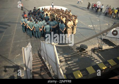 Indonesian navy cadets and officers attending a briefing, photographed from KRI Dewaruci (Dewa Ruci), an Indonesian tall ship, as the barquentine type schooner is opened for public visitors at Kolinlamil harbour (Navy harbour) in Tanjung Priok, North Jakarta, Jakarta, Indonesia. Stock Photo