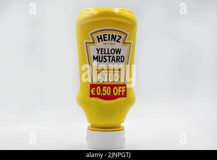 Kyiv, Ukraine - June 02, 2021: Studio shoot of Heinz product in squeezable plastic bottles consisting of Yellow Mustard closeup on white. Stock Photo