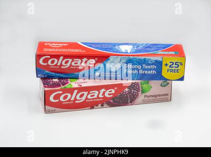 Kyiv, Ukraine - October 31, 2021: Colgate pomegranate, calcium and fluoride toothpaste packs closeup on white. Colgate is a manufacturer of a wide ran Stock Photo