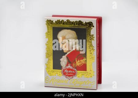 Kyiv, Ukrasine - December 26, 2021: Mozart Kugeln traditional sweets box closeup on white. Largest producer of Mozartkugeln is the German company Rebe Stock Photo