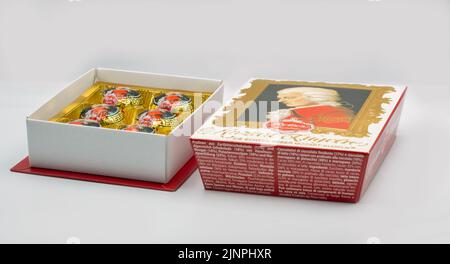 Kyiv, Ukrasine - December 26, 2021: Mozart Kugeln traditional sweets box closeup on white. Largest producer of Mozartkugeln is the German company Rebe Stock Photo