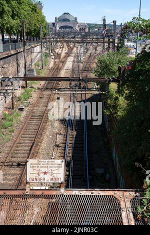 electrifed railway tracks lead to the Gare de Limoges-Bénédictins, a famous railway station in Limoges France Stock Photo