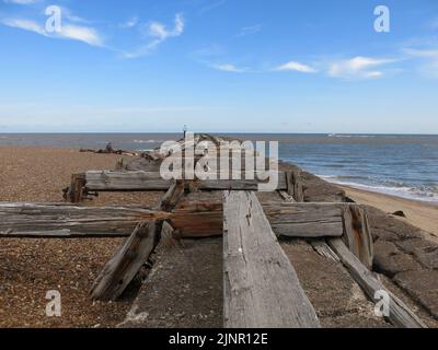 Used to transport sea mines to defend Harwich Harbour, the old wooden planks are all that's left of the railway jetty at Landguard Point, Felixstowe. Stock Photo