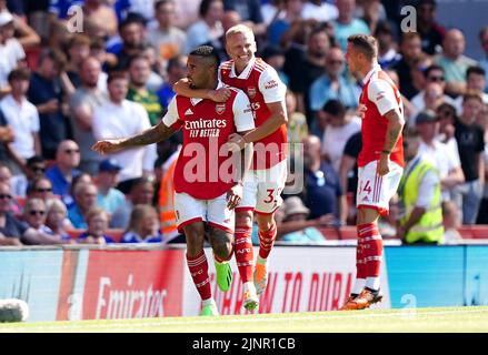 Arsenal's Gabriel Jesus (left) celebrates scoring their side's first goal of the game with team-mates Oleksandr Zinchenko and Granit Xhaka during the Premier League match at the Emirates Stadium, London. Picture date: Saturday August 13, 2022. Stock Photo