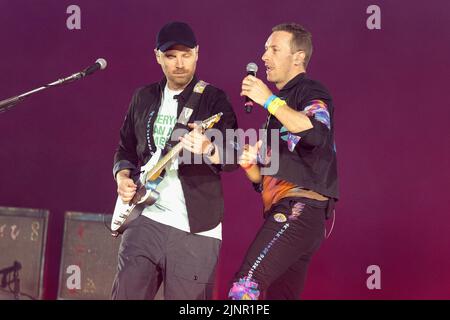 London, UK. 12th Aug, 2022. Jonny Buckland and Chris Martin of Coldplay perform Music of The Spheres World Tour at Wembley Stadium in London, England. Credit: S.A.M./Alamy Live News Stock Photo