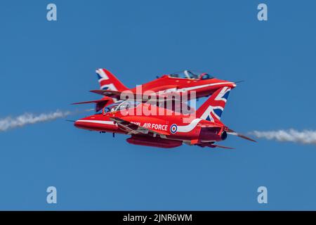 Red Arrows Syncro Pair Cross Stock Photo