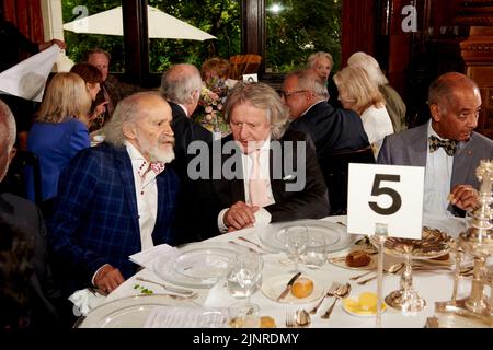 John Agard, Stephen Barlow & Sir Ken Olisa at Lunch for HRH The Duchess of Cornwall’s 75th birthday Stock Photo