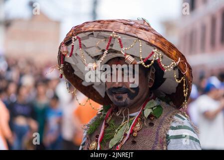 Kathmandu, Nepal. 13th Aug, 2022. A man with painted face seen during the Gai Jatra or cow festival procession. People celebrate Gai Jatra or cow festival in memory of the departed souls in the past year for salvation and peace. It is believed that cows guide the departed souls to cross the river to get to heaven. (Credit Image: © Bivas Shrestha/SOPA Images via ZUMA Press Wire) Stock Photo