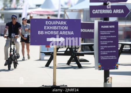 Herning, Denmark. 13th Aug, 2022. Equestrian sport, world championship, show jumping. Signposts point to an equestrian exhibition at the event site. Credit: Friso Gentsch/dpa/Alamy Live News Stock Photo
